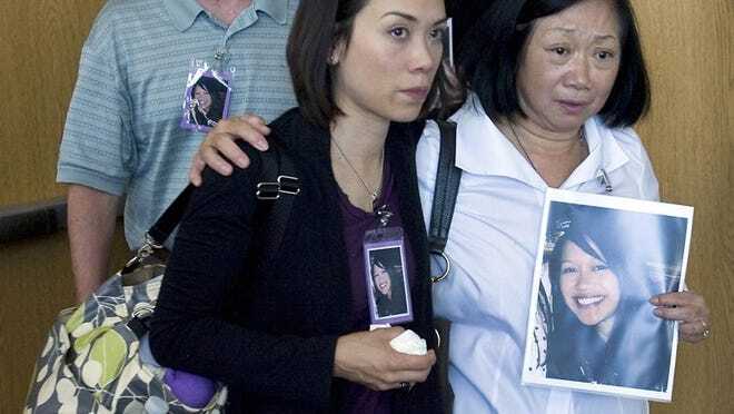 The family of Stacy Barnett — father Bill Barnett, sister Cathy Barnett and mother Joyce Barnett — exit the courtroom after her murderer was sentenced in a hearing Monday. Barnett and her boyfriend, John Goosey, were killed last year.